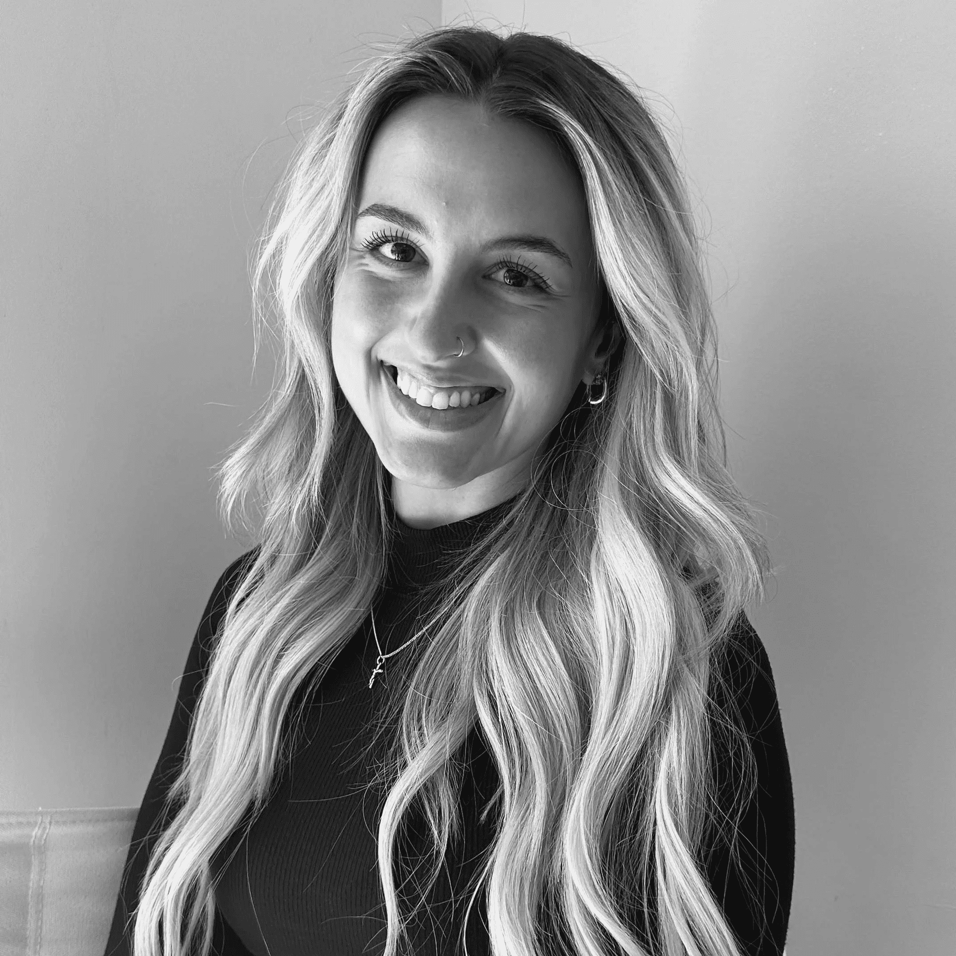 Portrait of Annalise, a professional stylist at Jungle Red Salon, showcasing their expertise and style.