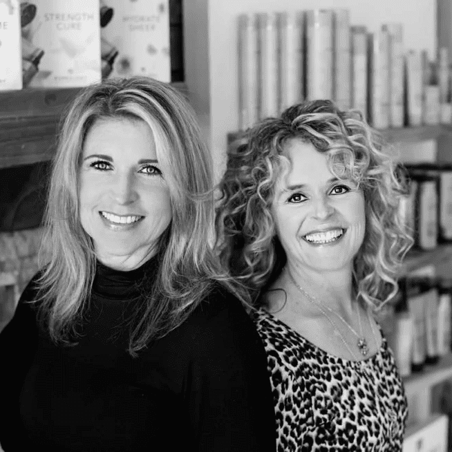 Portrait of Kristie & Lia, a professional stylist at Jungle Red Salon, showcasing their expertise and style.