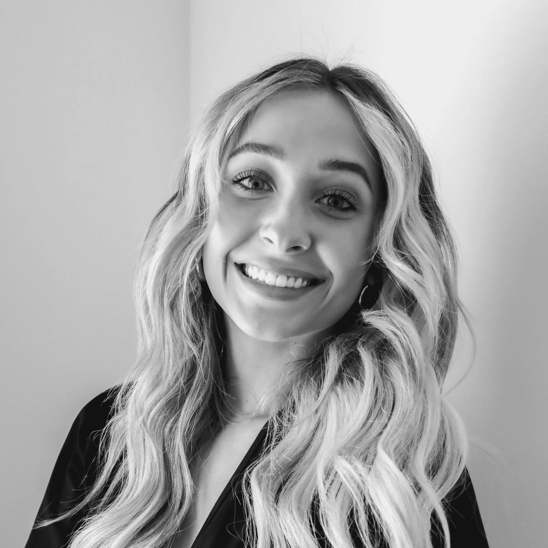 Portrait of Meredith, a professional stylist at Jungle Red Salon, showcasing their expertise and style.