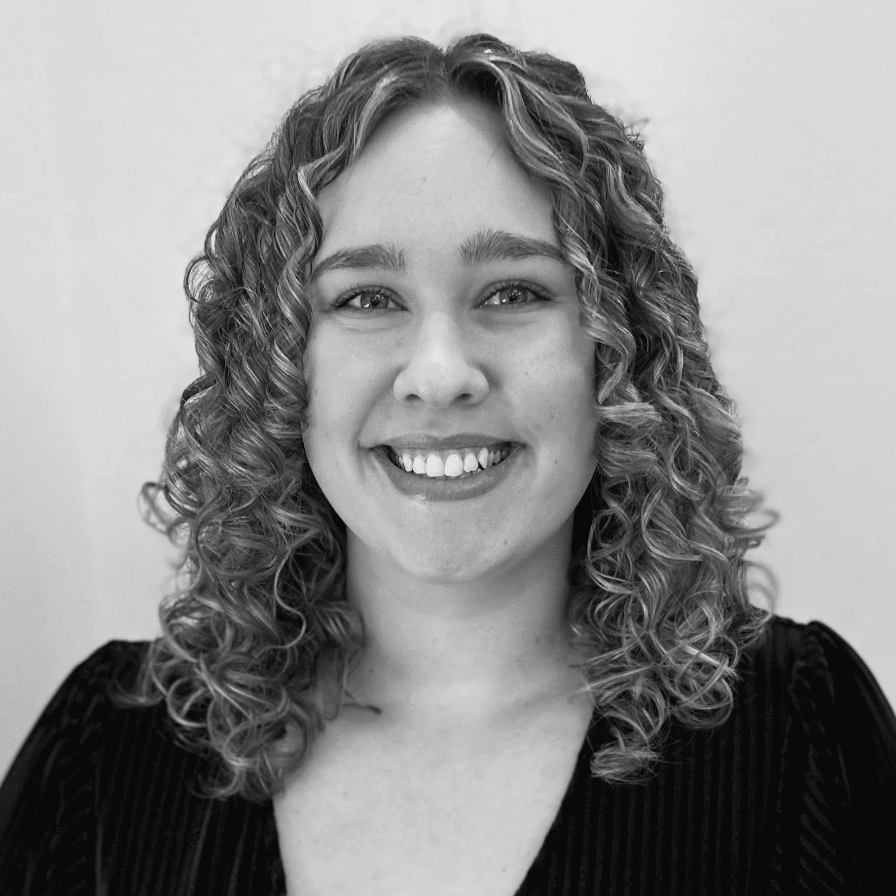 Portrait of Libby, a professional stylist at Jungle Red Salon, showcasing their expertise and style.