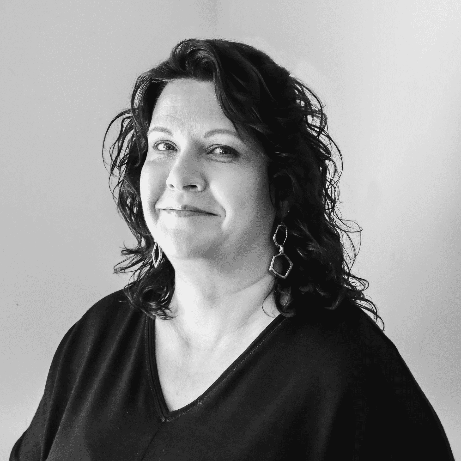 Portrait of Elizabeth, a professional stylist at Jungle Red Salon, showcasing their expertise and style.