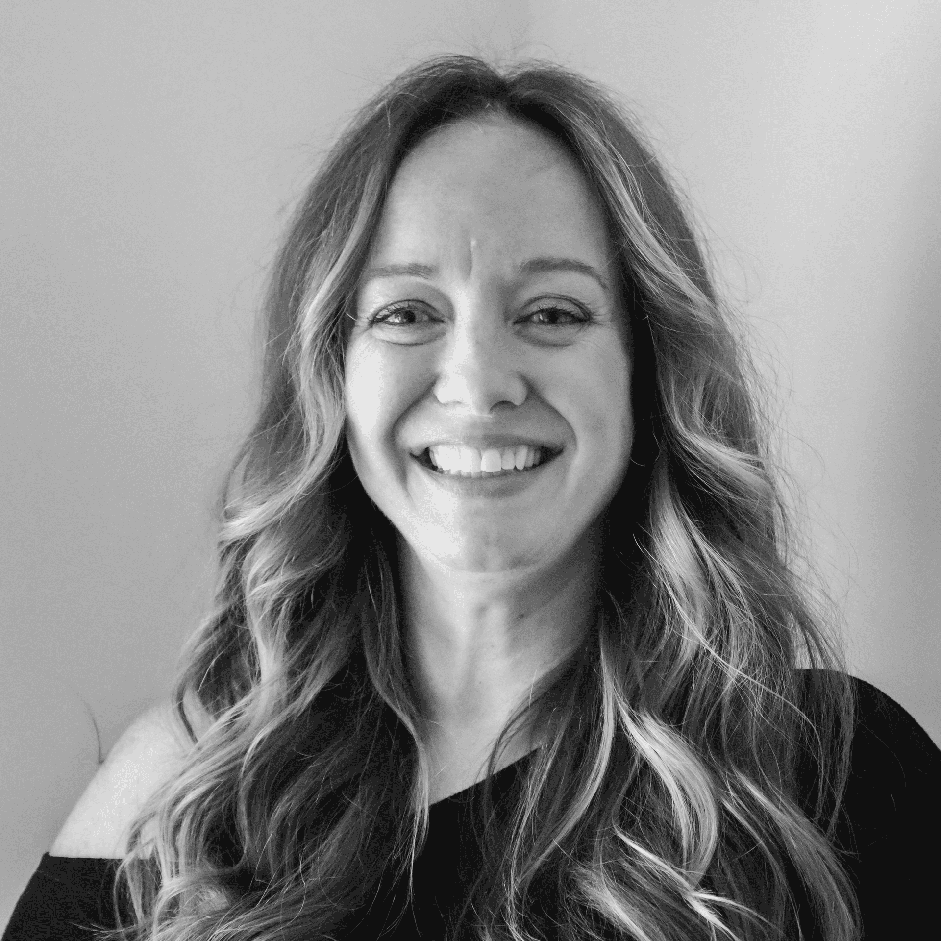Portrait of Jennifer, a professional stylist at Jungle Red Salon, showcasing their expertise and style.