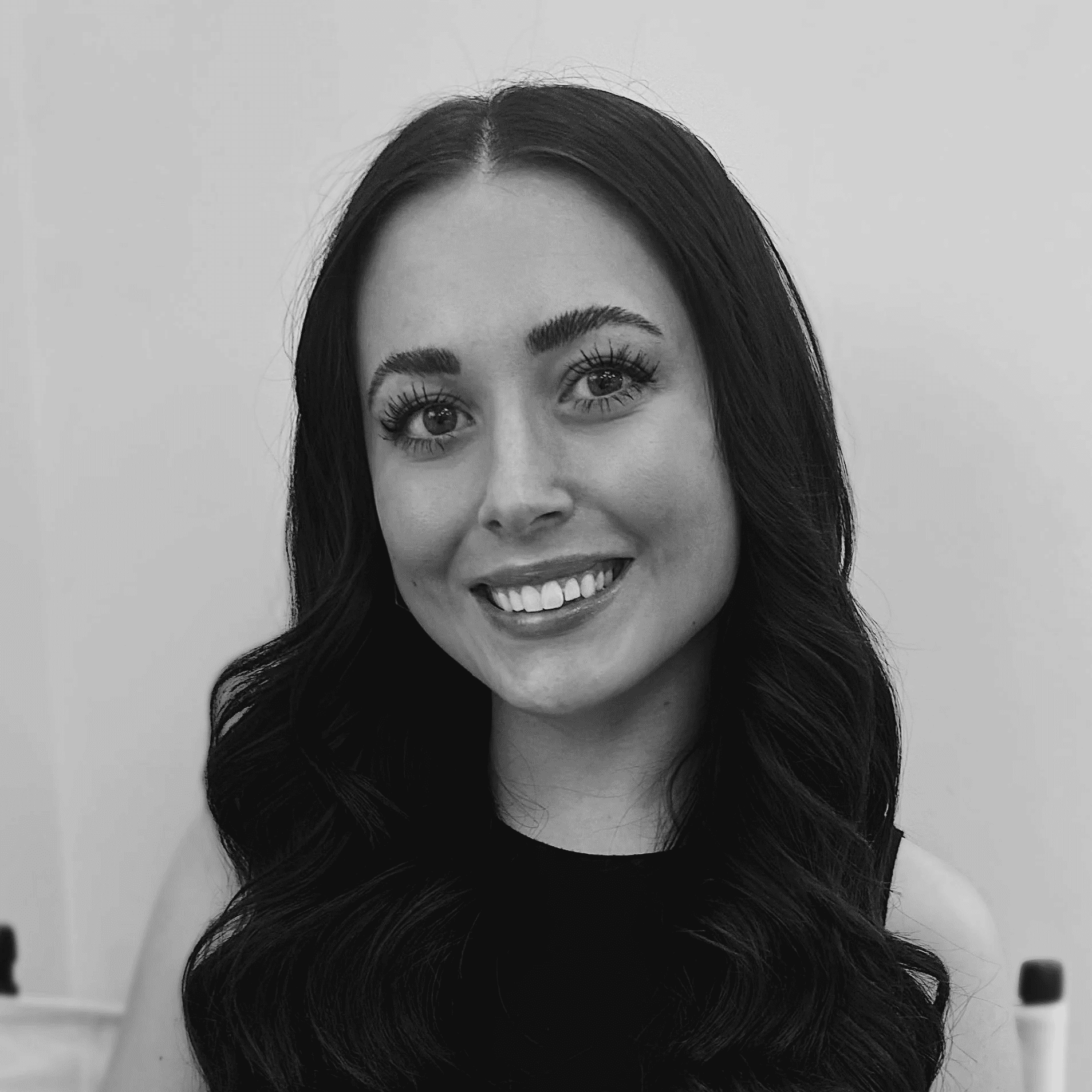 Portrait of Alyssa, a professional stylist at Jungle Red Salon, showcasing their expertise and style.