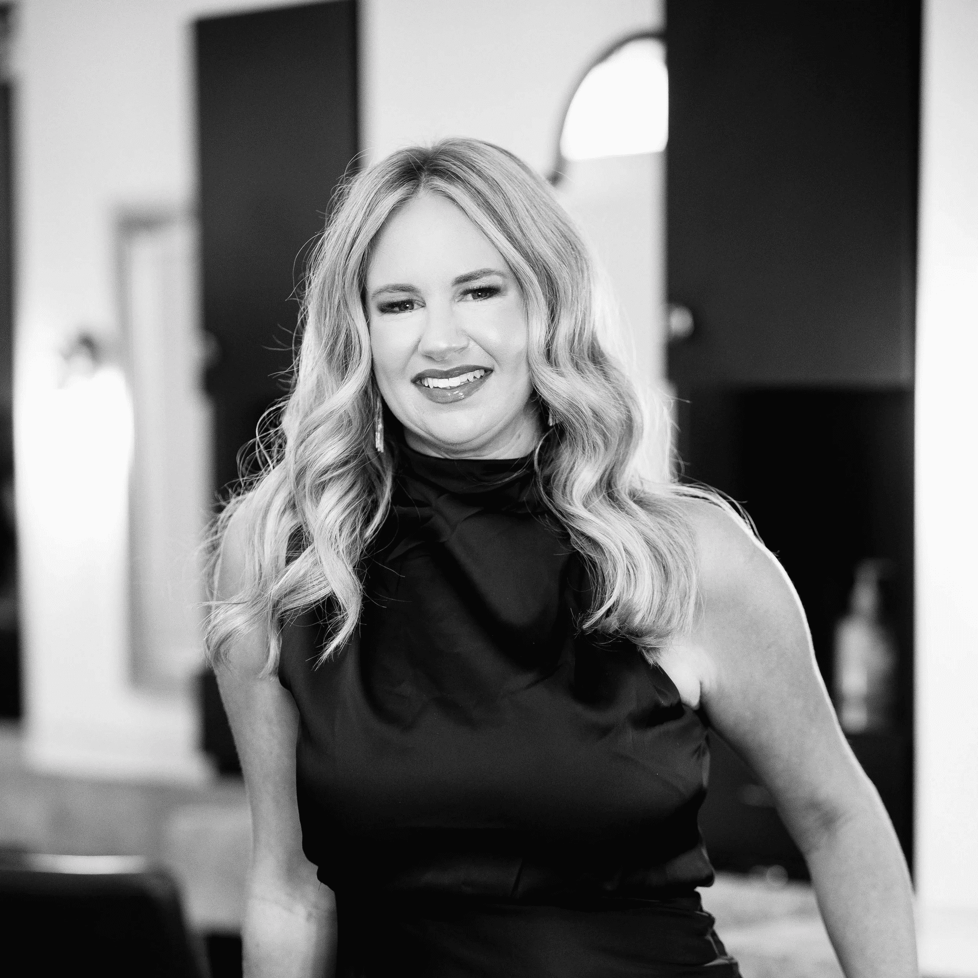 Portrait of Julia, a professional stylist at Jungle Red Salon, showcasing their expertise and style.