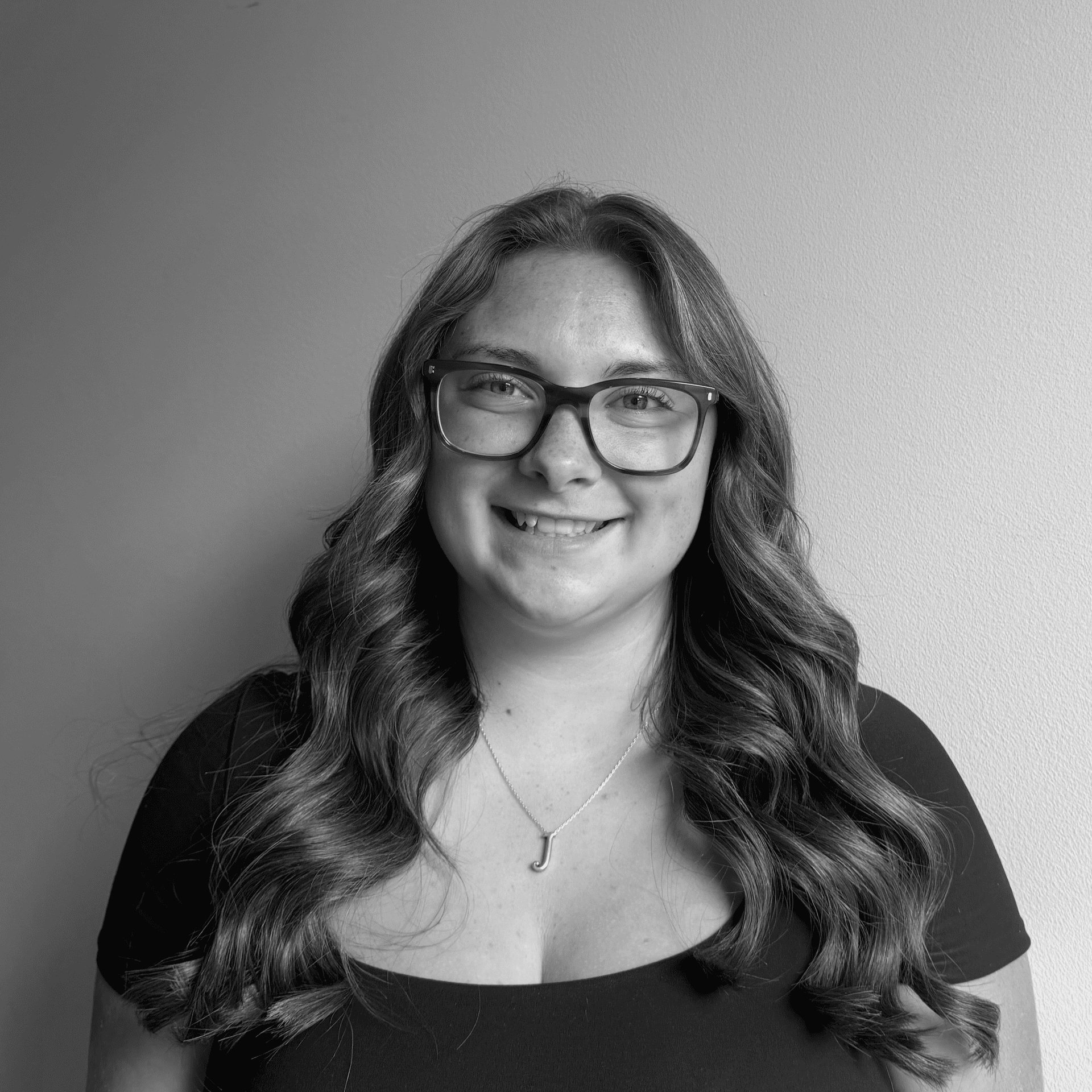 Portrait of Josie, a professional stylist at Jungle Red Salon, showcasing their expertise and style.