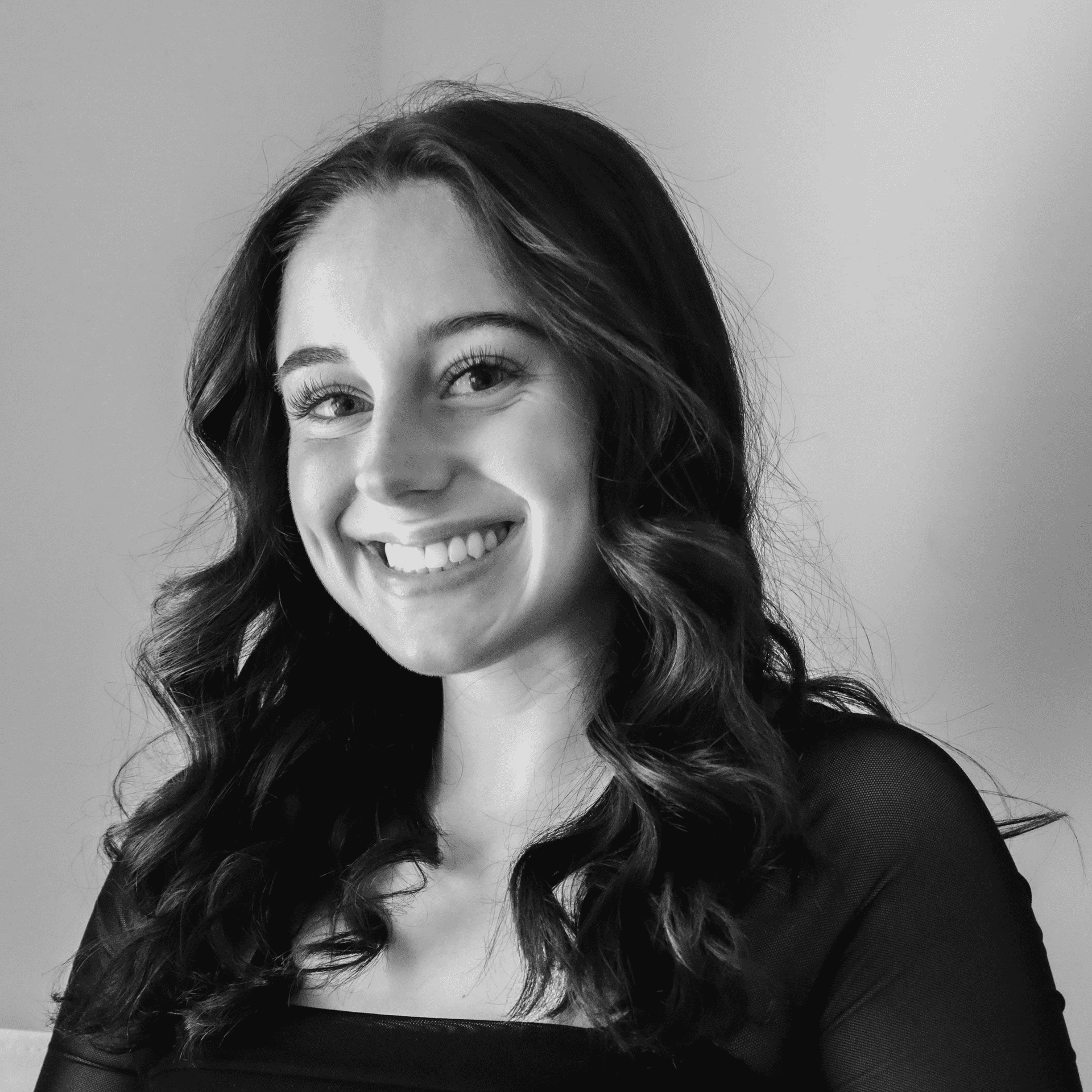 Portrait of Morgan, a professional stylist at Jungle Red Salon, showcasing their expertise and style.