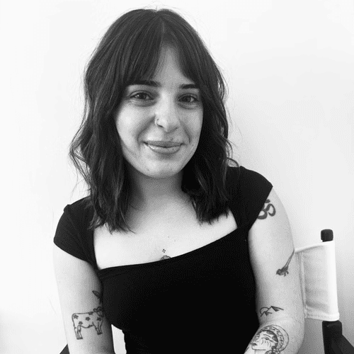 Portrait of Adeline, a professional stylist at Jungle Red Salon, showcasing their expertise and style.