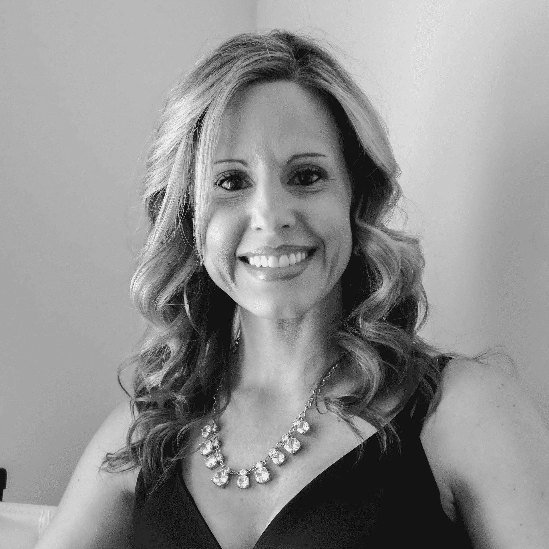 Portrait of Christin Grossnickle, a professional stylist at Jungle Red Salon, showcasing their expertise and style.