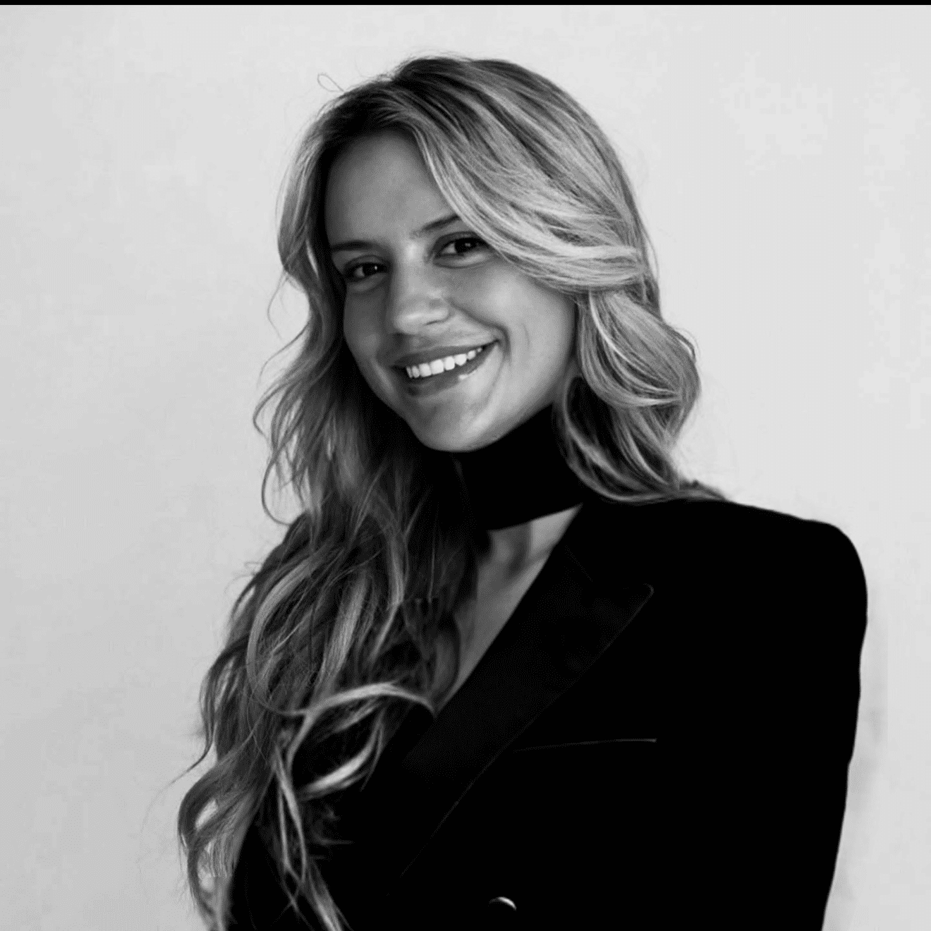 Portrait of Abby, a professional stylist at Jungle Red Salon, showcasing their expertise and style.