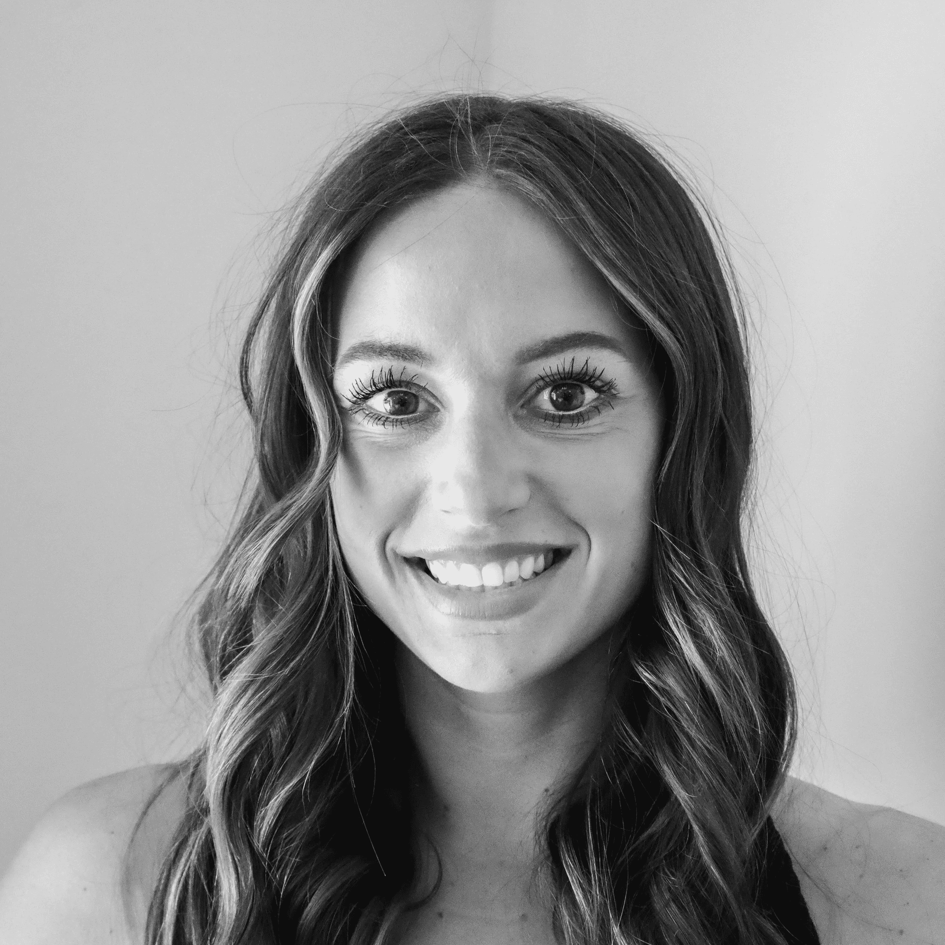 Portrait of Megan, a professional stylist at Jungle Red Salon, showcasing their expertise and style.