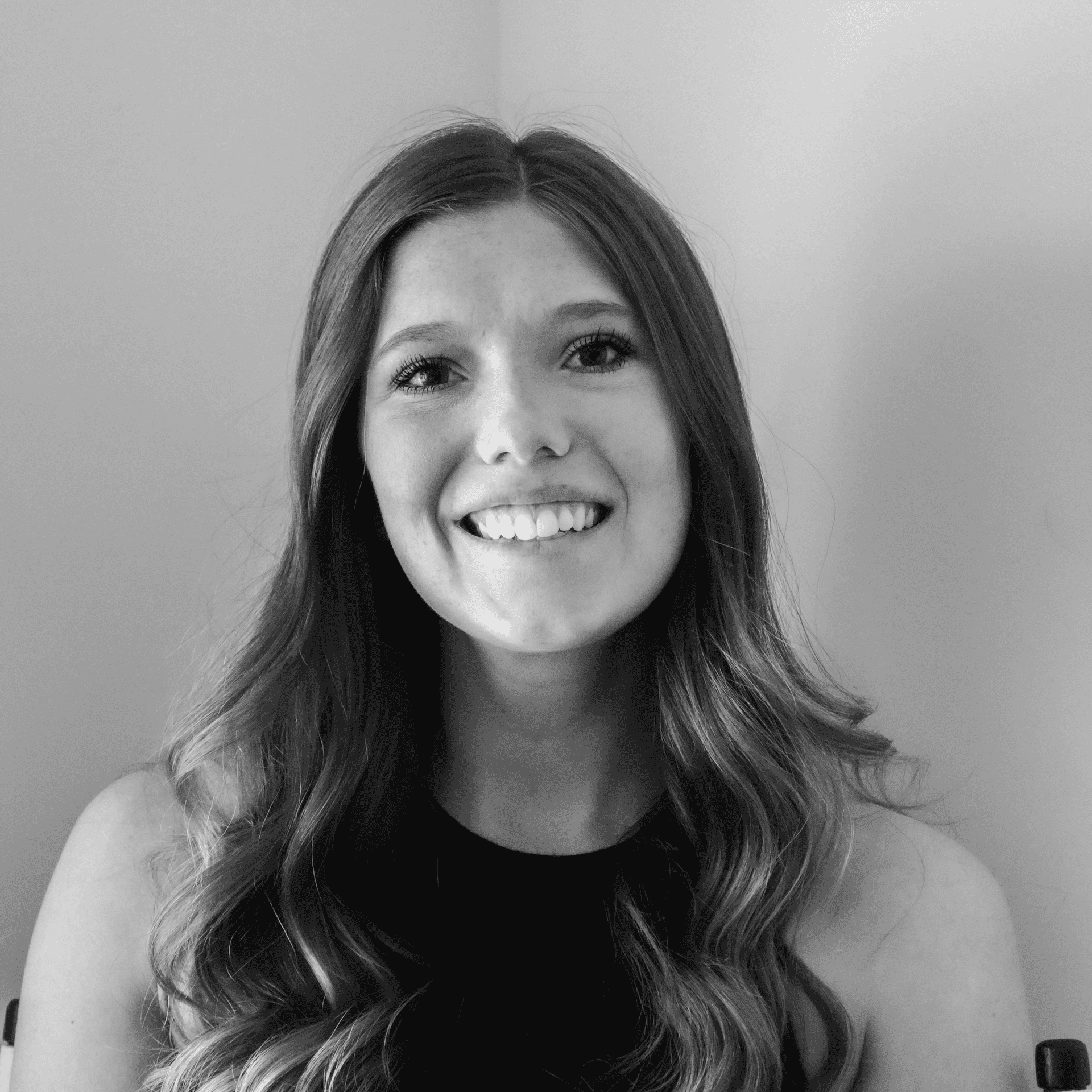 Portrait of Meg, a professional stylist at Jungle Red Salon, showcasing their expertise and style.